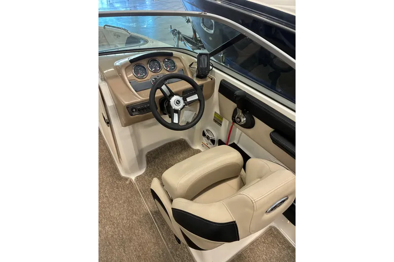 Slide: The Image of 2017 Chaparral 21 H2O Ski & Fish boat interior with steering wheel and dashboard. - 7