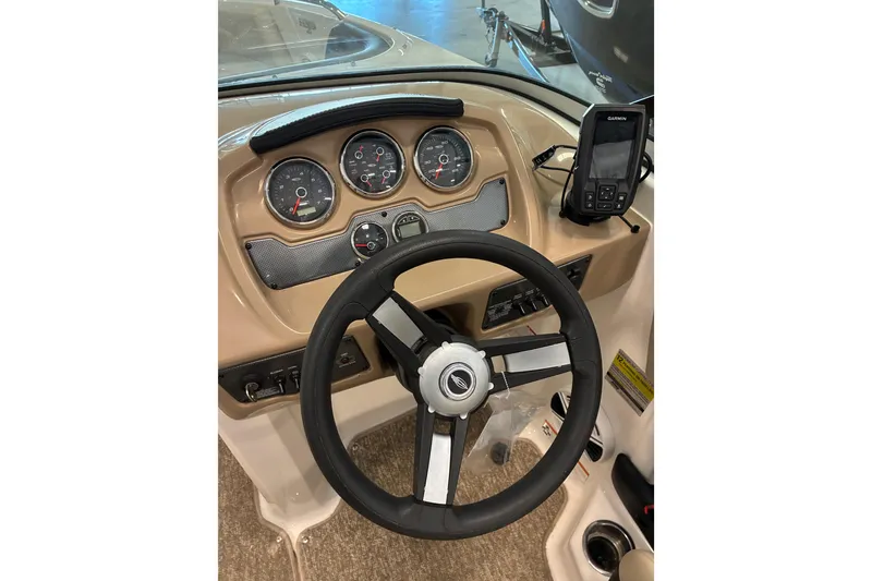 Slide: The Image of 2017 Chaparral 21 H2O Ski & Fish dashboard with steering wheel and Garmin device. - 8