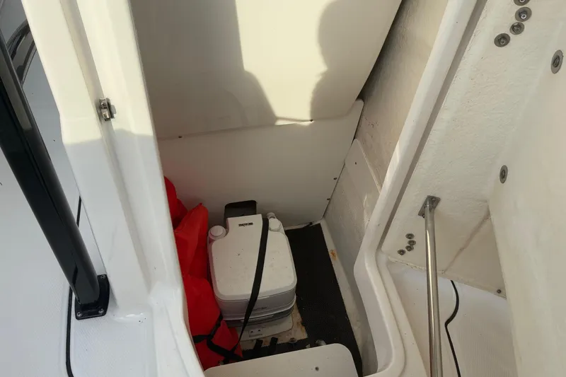 Slide: The Image of Interior of 2023 Robalo R222 Center Console with storage area. - 11