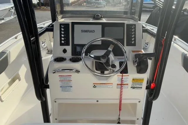 Slide: The Image of Robalo R222 Center Console 2023 helm with Simrad display. - 16