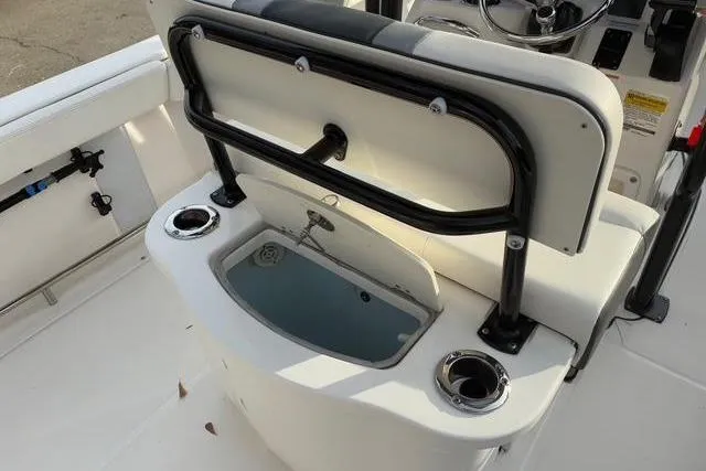 Slide: The Image of 2023 Robalo R222 Center Console with seating and cup holders. - 17