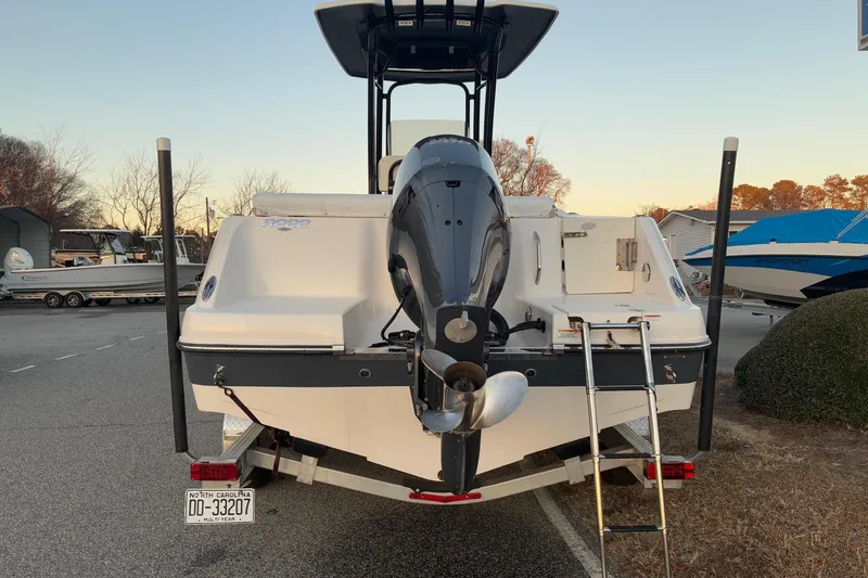 Slide: The Image of 2023 Robalo R222 Center Console with outboard motor and ladder. - 2