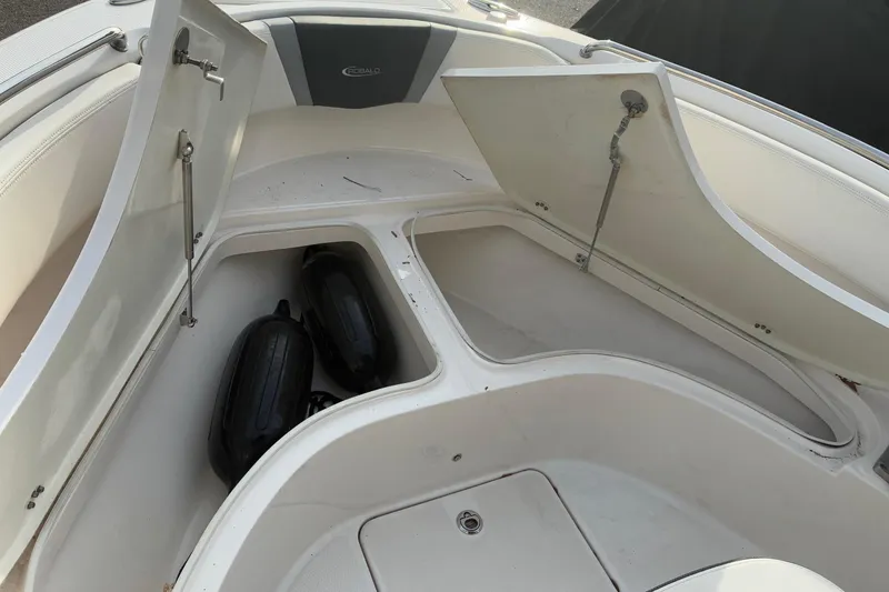 Slide: The Image of 2023 Robalo R222 Center Console storage with fenders. - 10