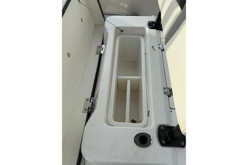Slide: The Image of Robalo R222 Center Console 2023, interior storage compartment view. - 7