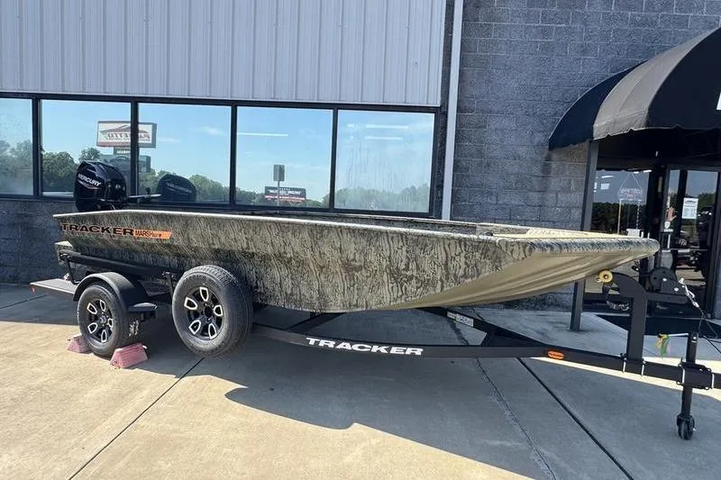 The Image of 2026 Tracker Grizzly 1756 T Marsh boat on trailer outside dealership. - 0