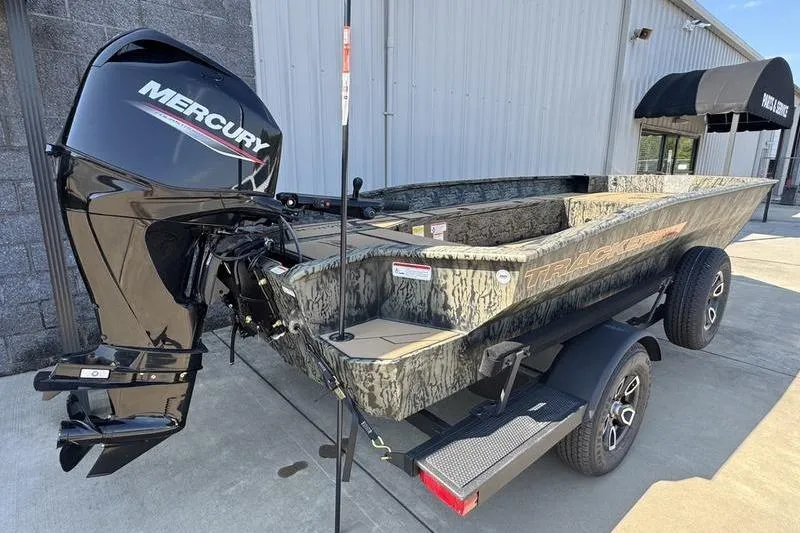 Slide: The Image of 2026 Tracker Grizzly 1756 T Marsh boat with Mercury engine, parked on trailer. - 10