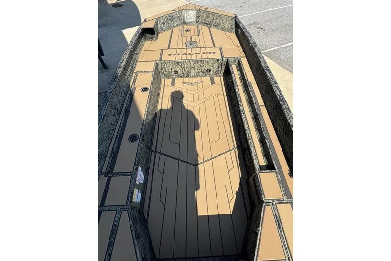 Slide: The Image of 2026 Tracker Grizzly 1756 T Marsh boat interior with camouflage design and spacious deck. - 14