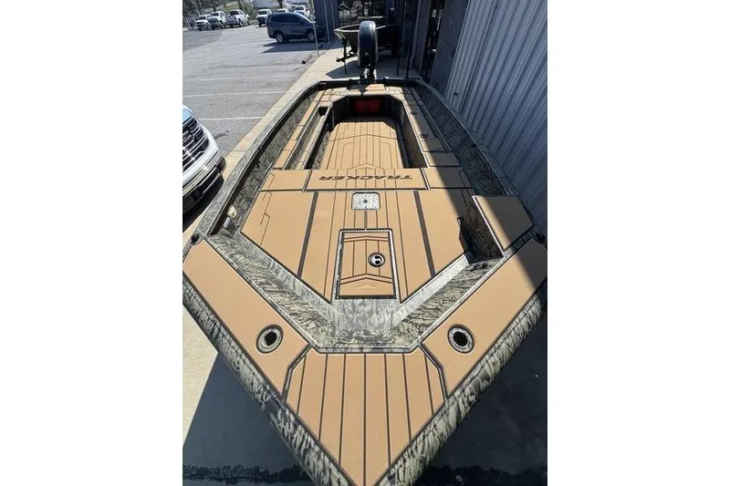 Slide: The Image of 2026 Tracker Grizzly 1756 T Marsh boat with camouflage and tan deck design. - 18
