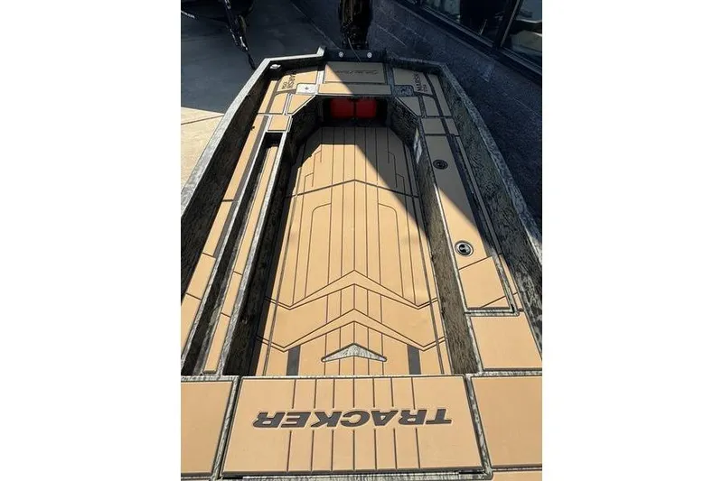 Slide: The Image of 2026 Tracker Grizzly 1756 T Marsh boat interior with tan deck and storage compartments. - 20