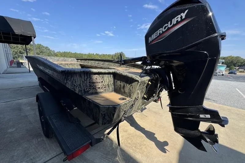 Slide: The Image of 2026 Tracker Grizzly 1756 T Marsh boat with Mercury outboard motor on trailer. - 9