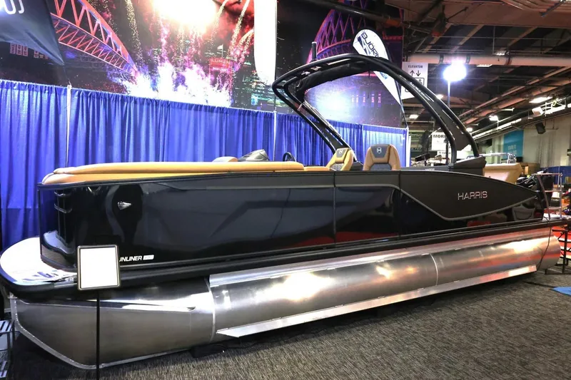 The Image of 2026 Harris Sunliner 230 Sport pontoon boat displayed at an indoor exhibition. - 1