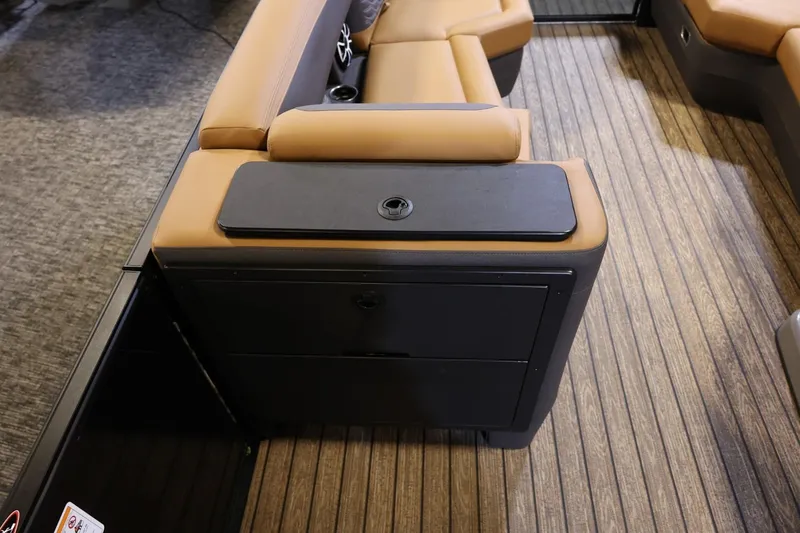 Slide: The Image of 2026 Harris Sunliner 230 Sport interior with tan seating and wood-style flooring. - 11