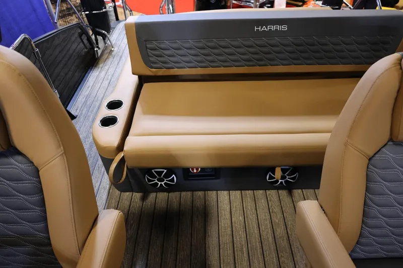 Slide: The Image of 2026 Harris Sunliner 230 Sport interior with tan seating and cup holders. - 13