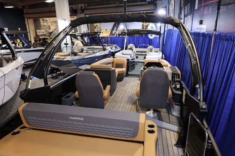 Slide: The Image of 2026 Harris Sunliner 230 Sport pontoon boat interior at a boat show display. - 16