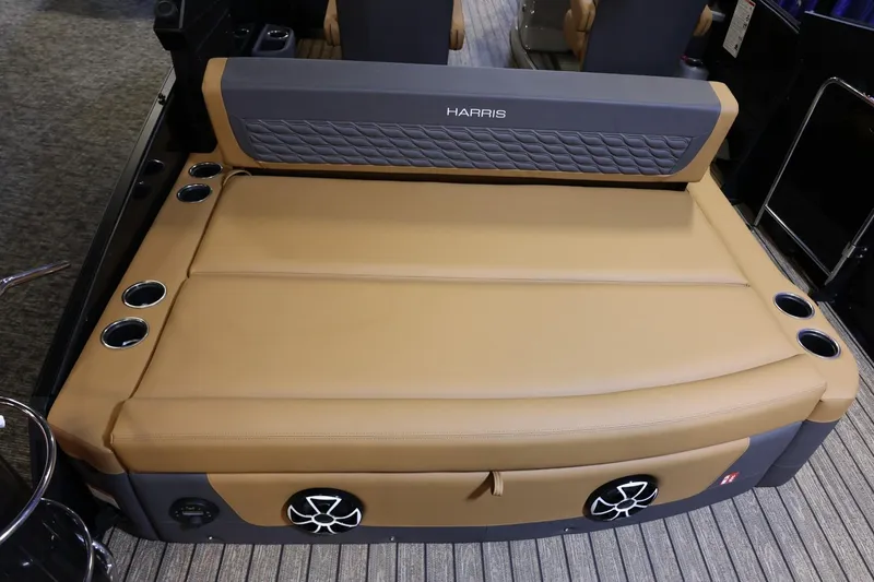 Slide: The Image of 2026 Harris Sunliner 230 Sport boat seating with cup holders and speakers. - 21