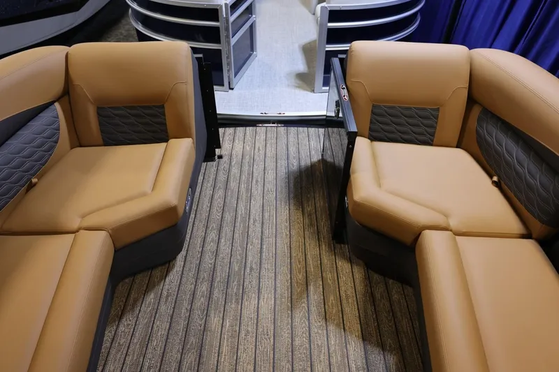Slide: The Image of 2026 Harris Sunliner 230 Sport interior with tan and gray seating, striped flooring. - 7