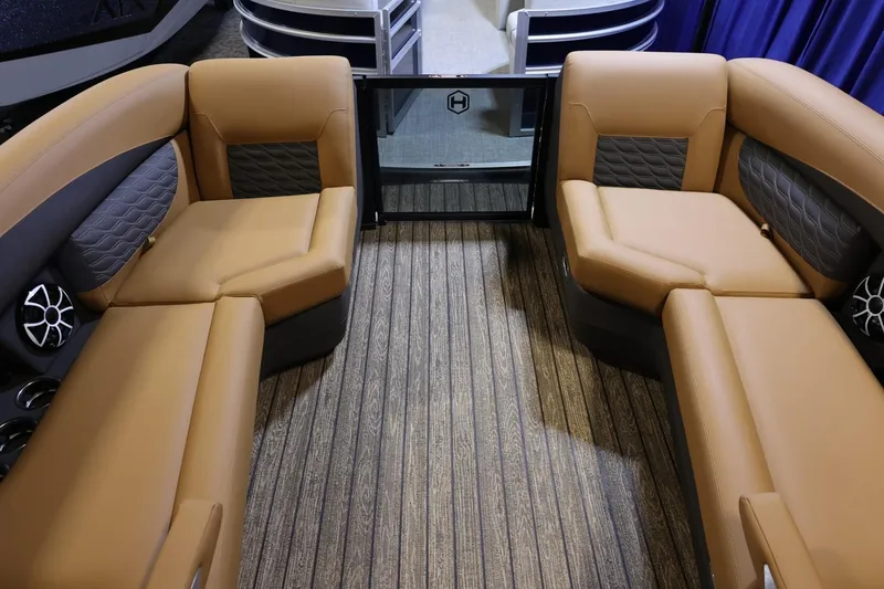 Slide: The Image of 2026 Harris Sunliner 230 Sport interior with tan seating and modern design. - 8