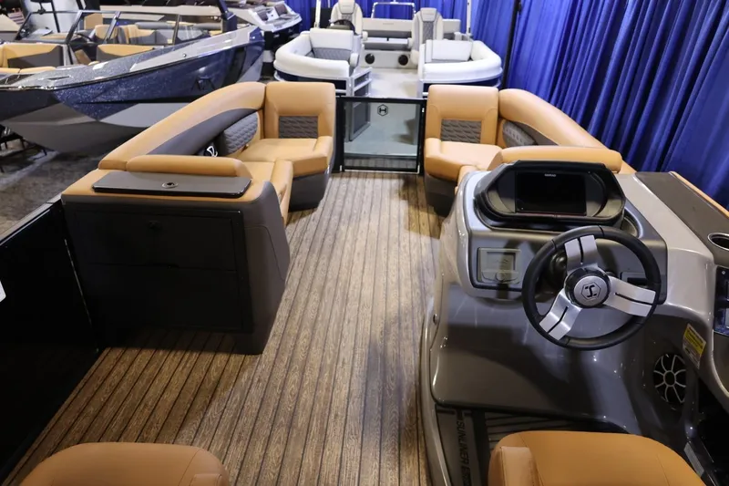 Slide: The Image of 2026 Harris Sunliner 230 Sport pontoon boat interior with luxurious seating and modern helm. - 9
