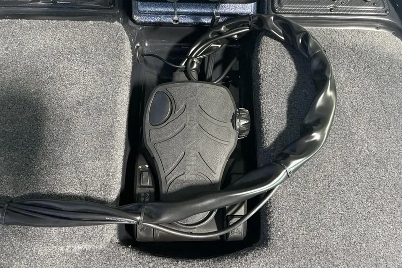 Slide: The Image of Foot pedal control in 2026 Phoenix 919 ZXL boat, surrounded by carpeted flooring. - 10
