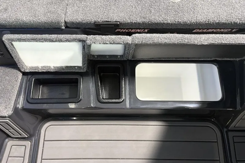 Slide: The Image of Interior compartments of 2026 Phoenix 919 ZXL boat, featuring storage and sleek design. - 16
