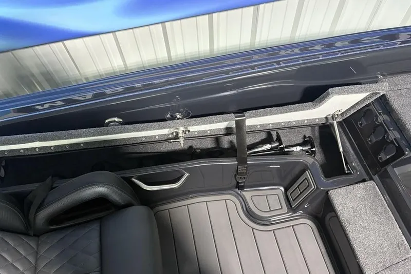 Slide: The Image of Interior view of 2026 Phoenix 919 ZXL boat, featuring storage compartments and seating. - 20