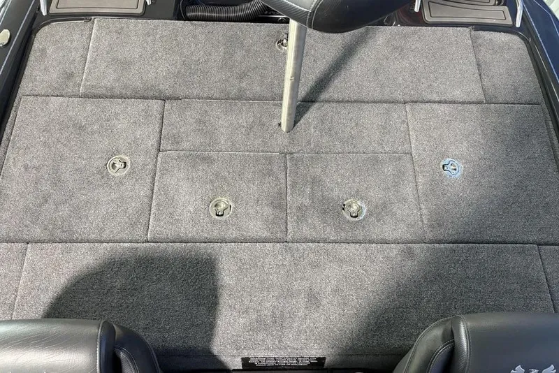 Slide: The Image of 2026 Phoenix 919 ZXL boat deck with gray carpet and seat post. - 21