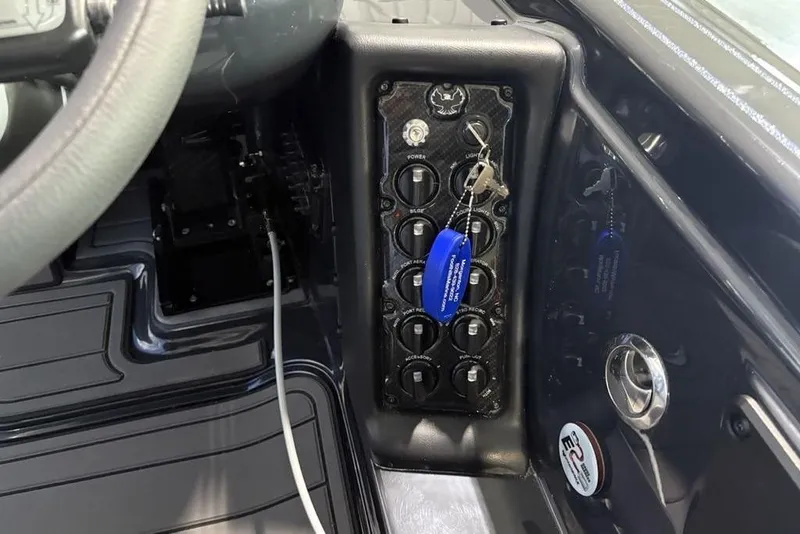 Slide: The Image of Control panel of 2026 Phoenix 919 ZXL with switches and ignition keys. - 24