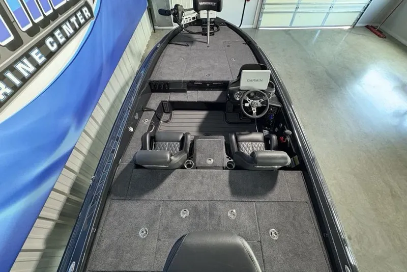 Slide: The Image of 2026 Phoenix 919 ZXL boat interior with Garmin system, spacious seating, and modern design. - 31