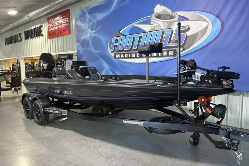 Slide: The Image of 2026 Phoenix 919 ZXL boat displayed at Foothills Marine Center showroom. - 4