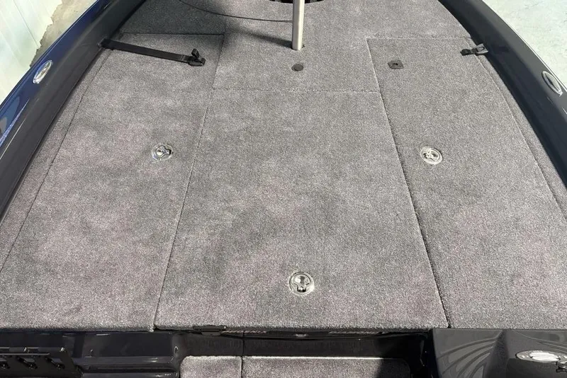 Slide: The Image of Carpeted deck of 2026 Phoenix 919 ZXL boat with storage compartments. - 7