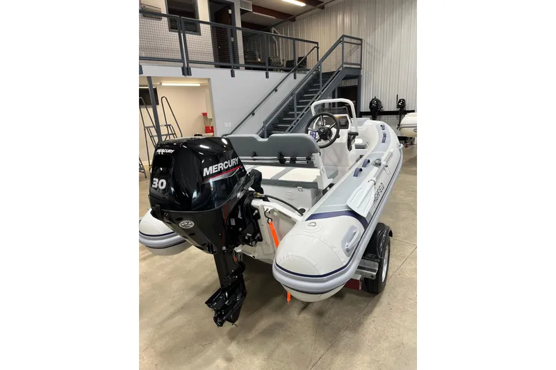 Slide: The Image of 2026 Highfield Classic 380 inflatable boat with Mercury 30 outboard motor in showroom. - 3