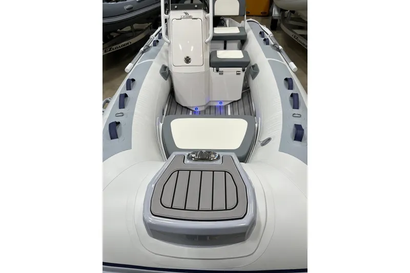 Slide: The Image of 2026 Highfield Classic 380 boat interior with seating and storage compartments. - 4
