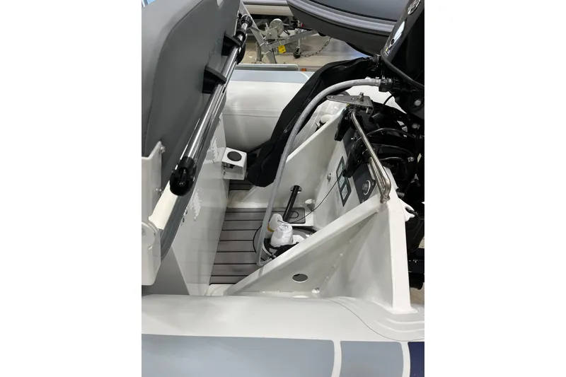 Slide: The Image of 2026 Highfield Classic 380 boat interior, showcasing seating and engine components. - 8