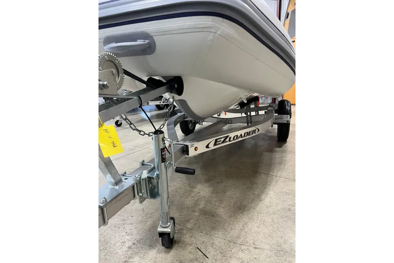 Slide: The Image of 2026 Highfield Classic 380 boat on EZ Loader trailer in garage. - 9