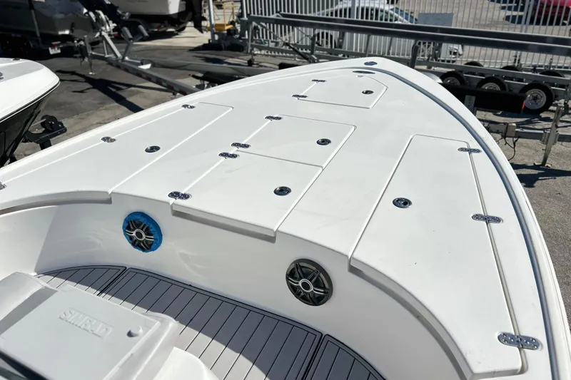 Slide: The Image of 2011 Cape Horn 23 Cape Bay boat deck with storage compartments and speakers. - 12