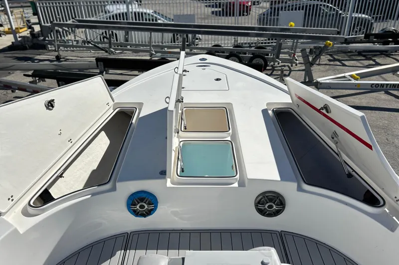 Slide: The Image of 2011 Cape Horn 23 Cape Bay boat deck with open storage compartments and speakers. - 15