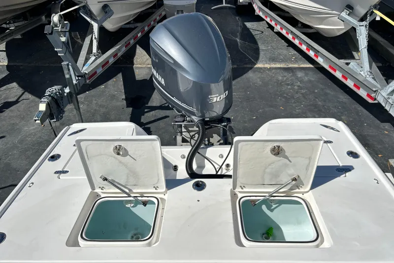 Slide: The Image of 2011 Cape Horn 23 Cape Bay boat with Yamaha 300 engine, open storage compartments. - 25