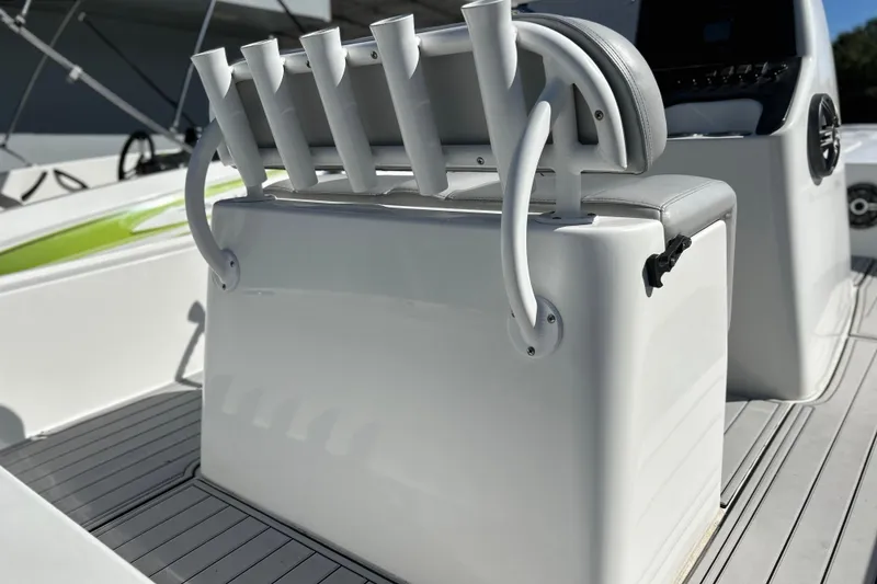Slide: The Image of 2011 Cape Horn 23 Cape Bay boat interior with rod holders and seating. - 6