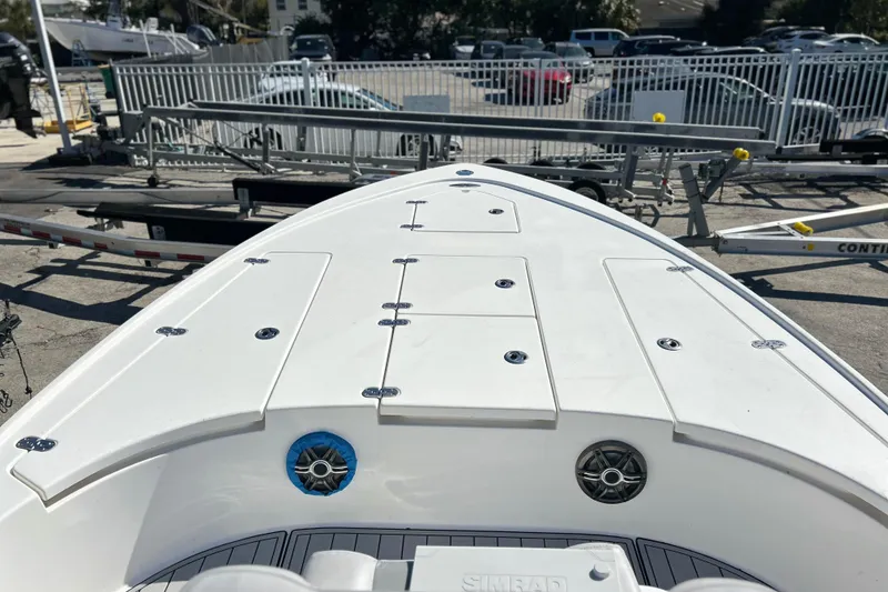 Slide: The Image of 2011 Cape Horn 23 Cape Bay boat deck with storage compartments and speakers. - 10