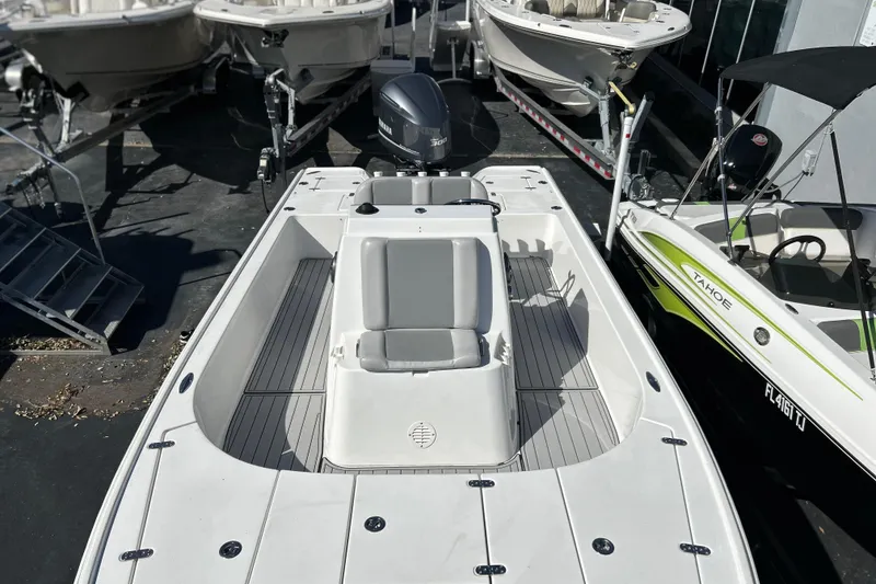 Slide: The Image of 2011 Cape Horn 23 Cape Bay boat with Yamaha engine, docked among other boats. - 17