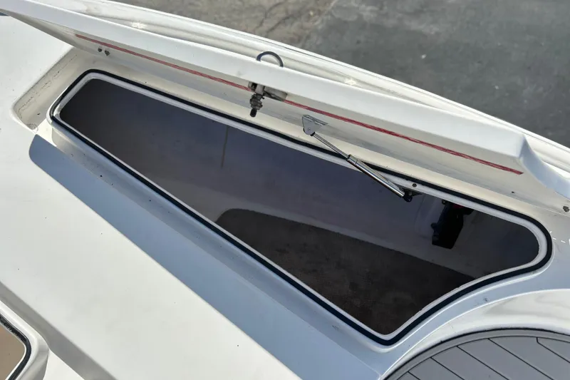 Slide: The Image of Open storage compartment on 2011 Cape Horn 23 Cape Bay boat. - 18