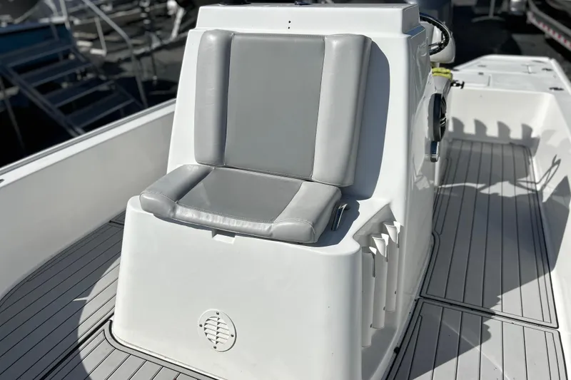 Slide: The Image of 2011 Cape Horn 23 Cape Bay boat with gray cushioned seating and sleek deck design. - 22