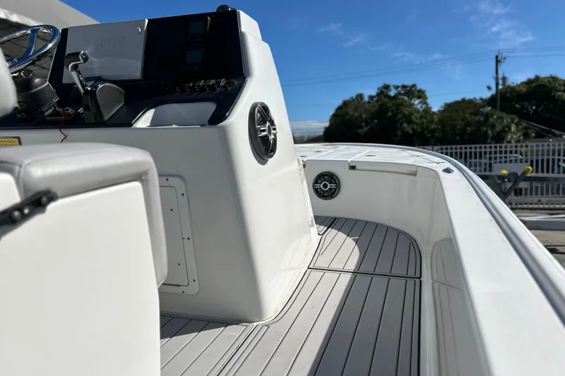 Slide: The Image of 2011 Cape Horn 23 Cape Bay boat interior with steering console and seating. - 26