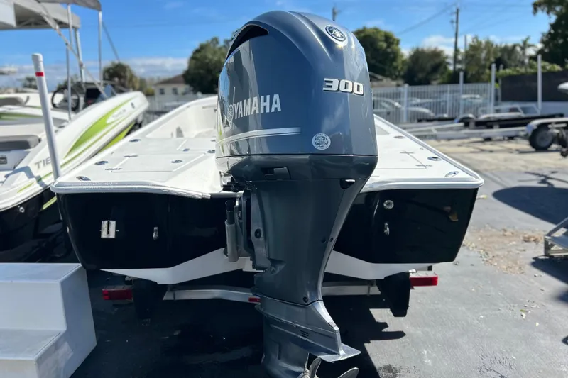 Slide: The Image of 2011 Cape Horn 23 Cape Bay boat with Yamaha 300 outboard motor, parked outdoors. - 27