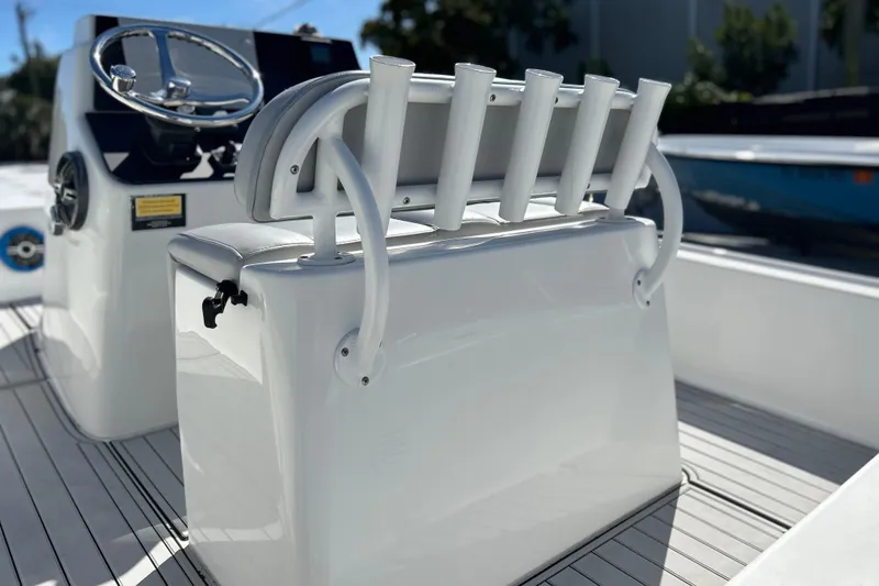 Slide: The Image of 2011 Cape Horn 23 Cape Bay boat interior with rod holders and steering console. - 5