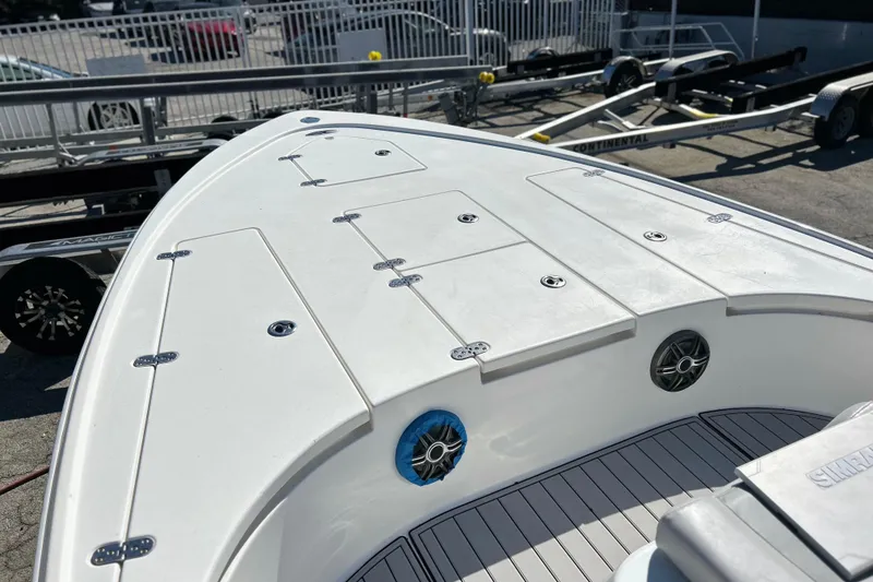 Slide: The Image of 2011 Cape Horn 23 Cape Bay boat deck with storage compartments and speakers. - 9