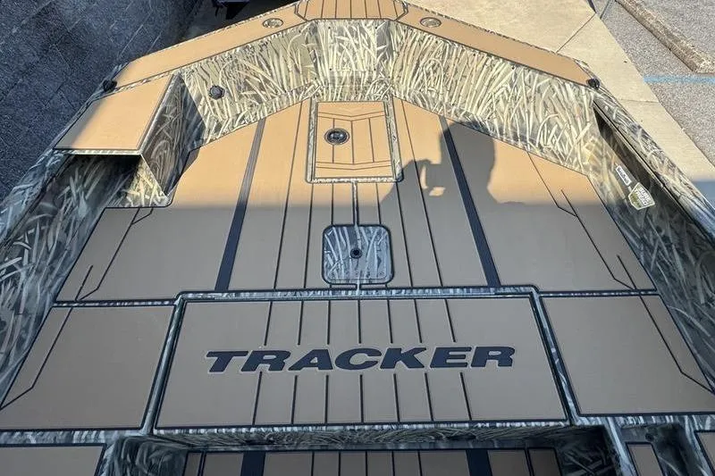 Slide: The Image of 2026 Tracker Grizzly 1756 T Marsh boat deck with camouflage design and logo. - 14