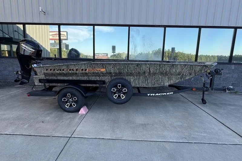 Slide: The Image of 2026 Tracker Grizzly 1756 T Marsh boat with camouflage design on a trailer. - 5