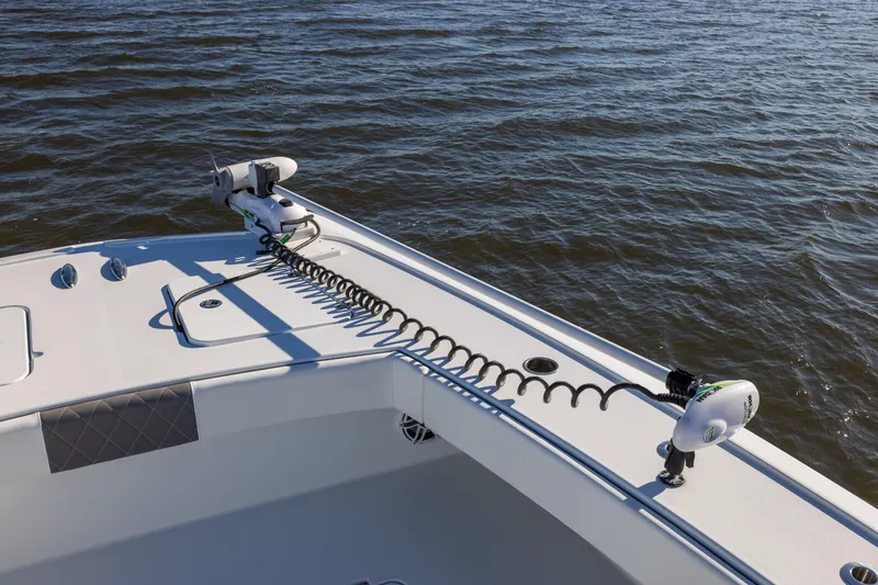 Slide: The Image of 2023 Freeman 34VH boat deck with trolling motor on calm water. - 10