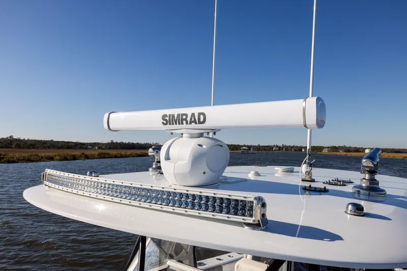 Slide: The Image of 2023 Freeman 34VH boat with Simrad radar system on calm water. - 11